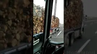 Vintage truck Iveco v8 road train loaded with wood overtakes at full speed