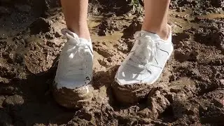 Muddy white sneakers in the forest, sneakers muddy, abused sneakers, sneakers in deep mud (# 837)