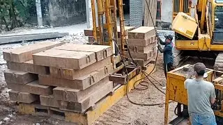 The process of pressing concrete piles to treat the foundation to build a level 2 house