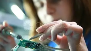 Female Technician Solders Circuit Board. Stock Footage