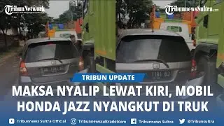 Viral! Maksa Nyalip Lewat Kiri, Mobil Honda Jazz Nyangkut di Ban Truk