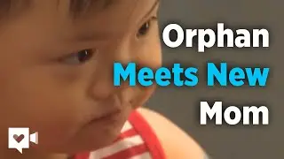 Watch how this orphan reacts when she meets her new momma