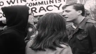 Large crowd of anti Vietnam war demonstrators march on the streets holding banner...HD Stock Footage