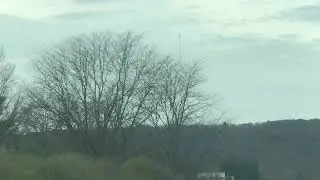 Cell phone towers at Binghamton NY with clouds